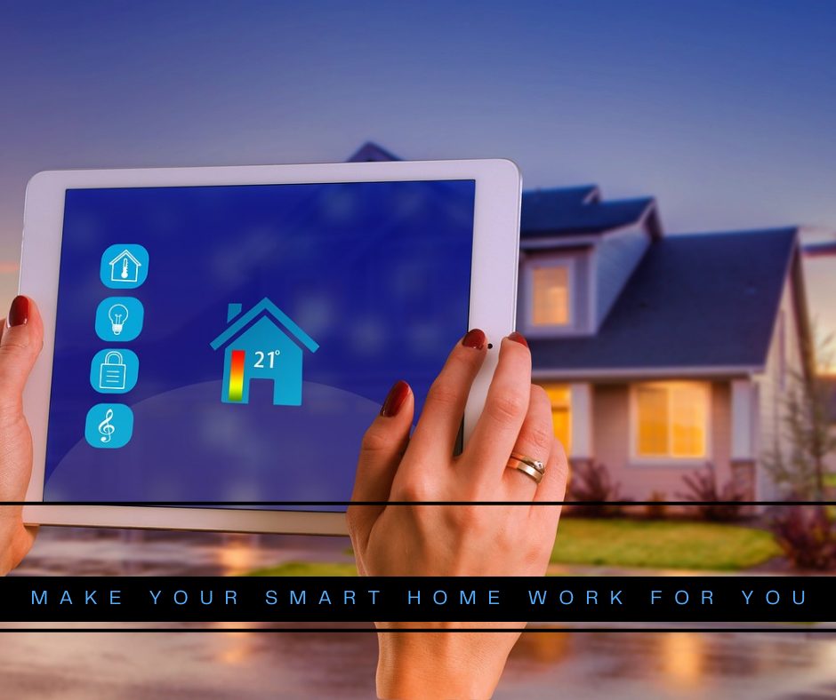 Picture the outside of a home with a set of female hands holding a white tablet. A black banner with blue writing says, "Make your smart home work for you."