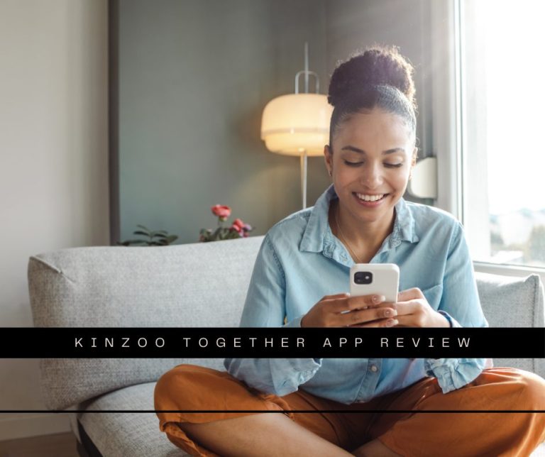 A young woman is at home in the living room, she is using a mobile phone and smiling