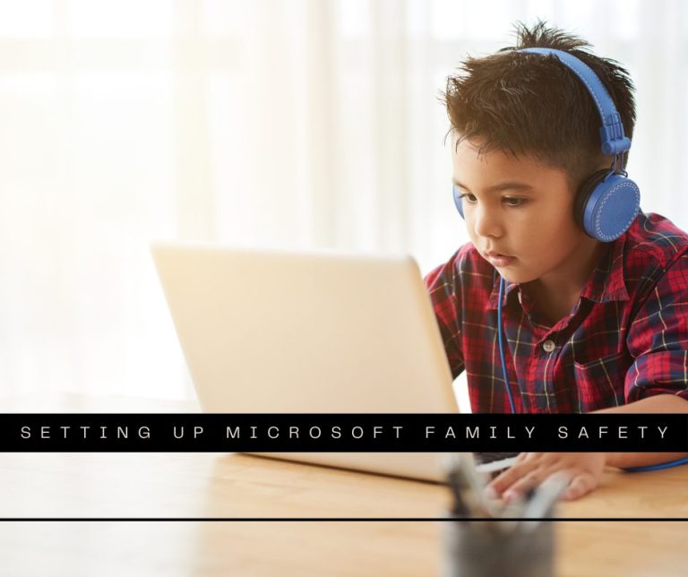 boy in headphones watching something on laptop at home