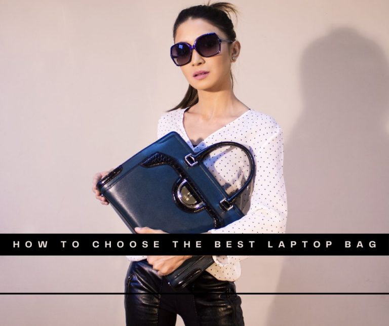 Woman in a white and black polka dot shirt holding a black bag